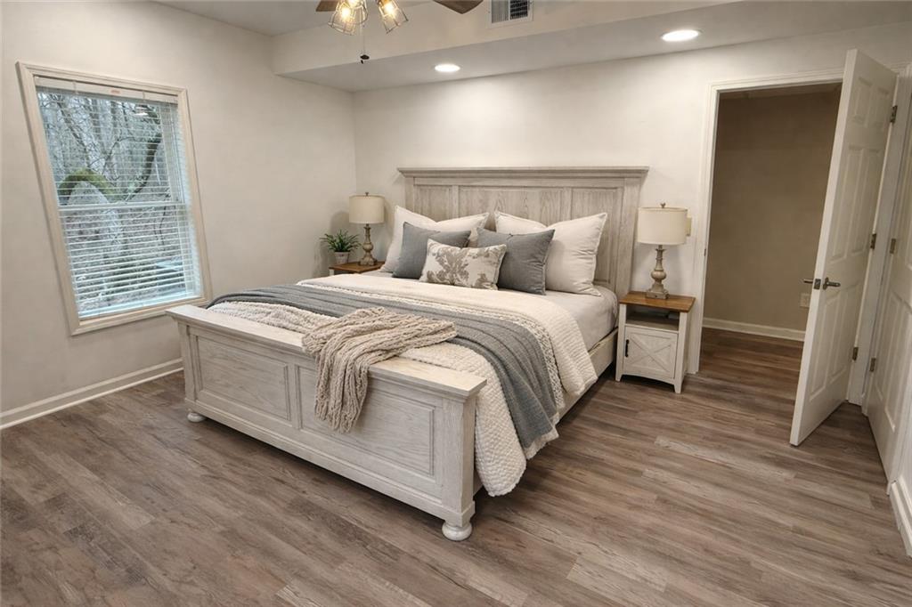 2865 Hightower Road Ball Ground, GA 30107 - Photo 30 of 41 a bed room with a bed and a window