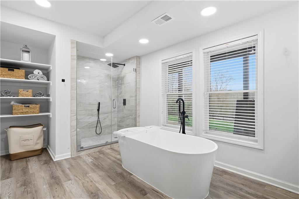 2865 Hightower Road Ball Ground, GA 30107 - Photo 31 of 41 a bathroom with a bathtub and a sink