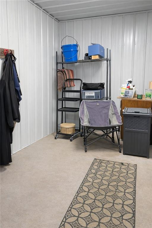 2865 Hightower Road Ball Ground, GA 30107 - Photo 37 of 41 a bedroom with furniture and a chair