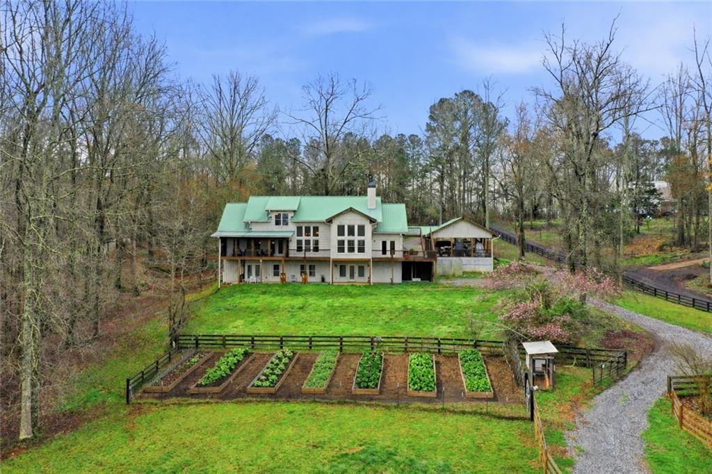 2865 Hightower Road Ball Ground, GA 30107 - Photo 4 of 41 a view of a house with backyard and garden