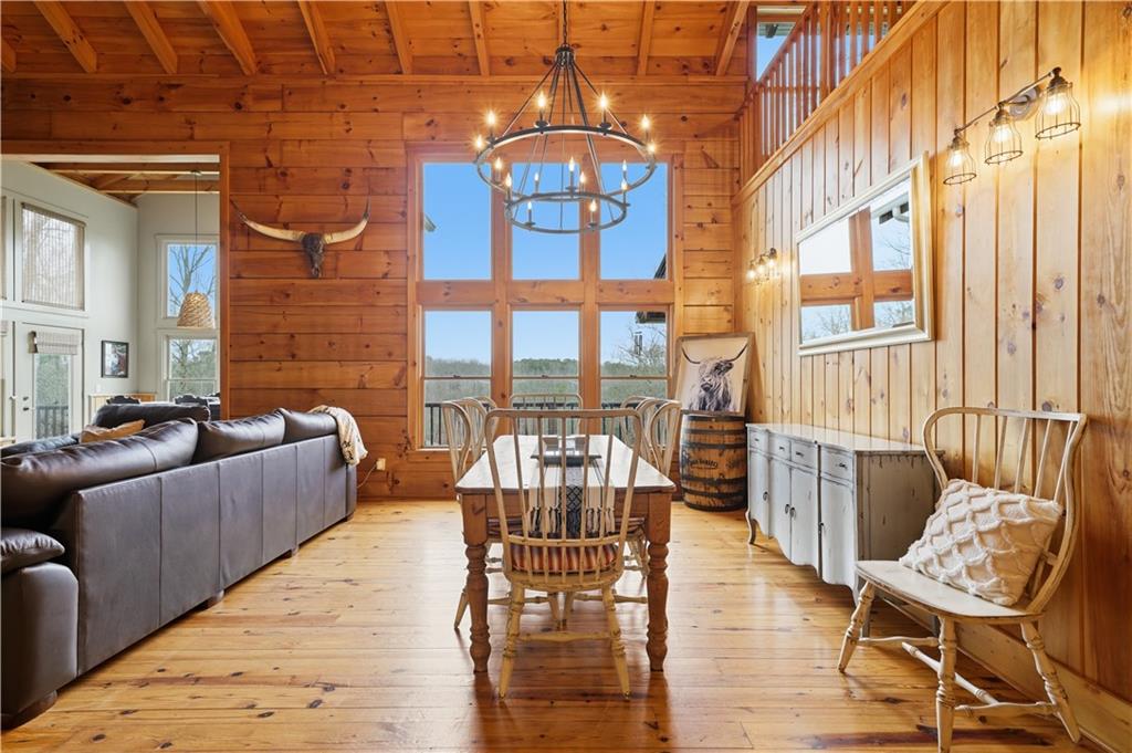 2865 Hightower Road Ball Ground, GA 30107 - Photo 10 of 41 a living room with furniture and a floor to ceiling window