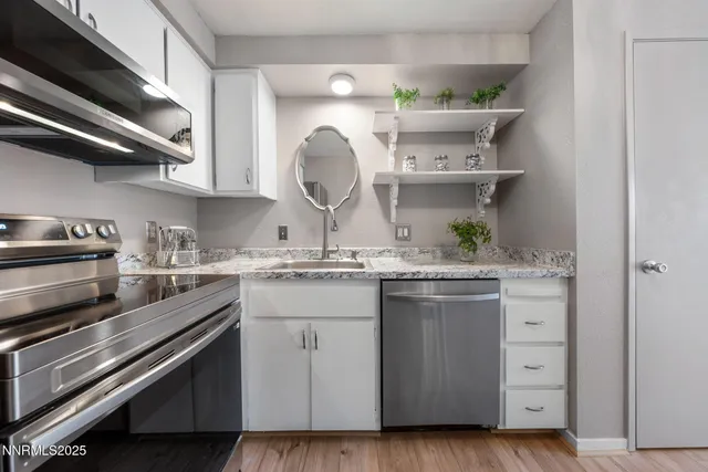 a kitchen with a stove and a sink