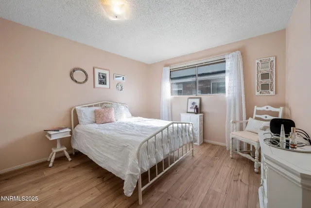 a bedroom with a bed and a table