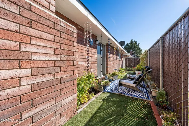 a view of a backyard with sitting area