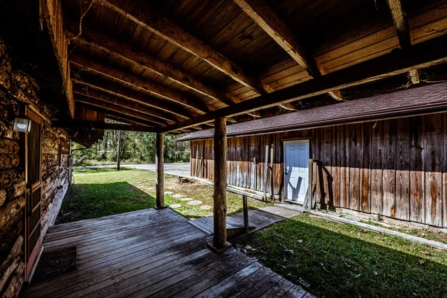 a view of a large room with wooden walls