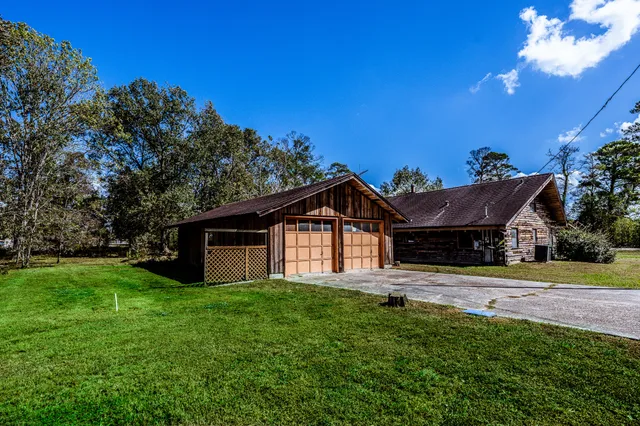 a view of empty room with wooden ceiling