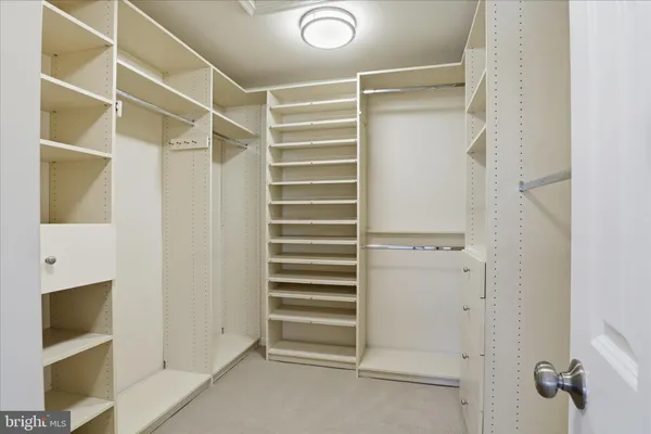 a en suite bathroom with a shower sink and mirror
