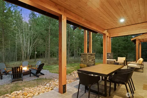 a patio with table and chairs