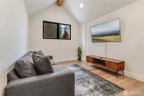 a living room with furniture and a rug