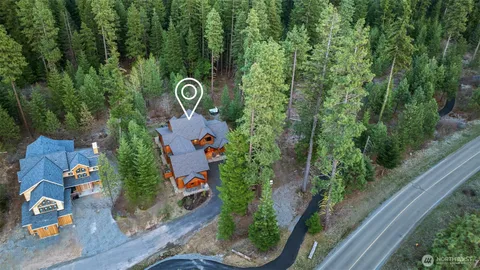an aerial view of a house with garden space wooden shelves and plants