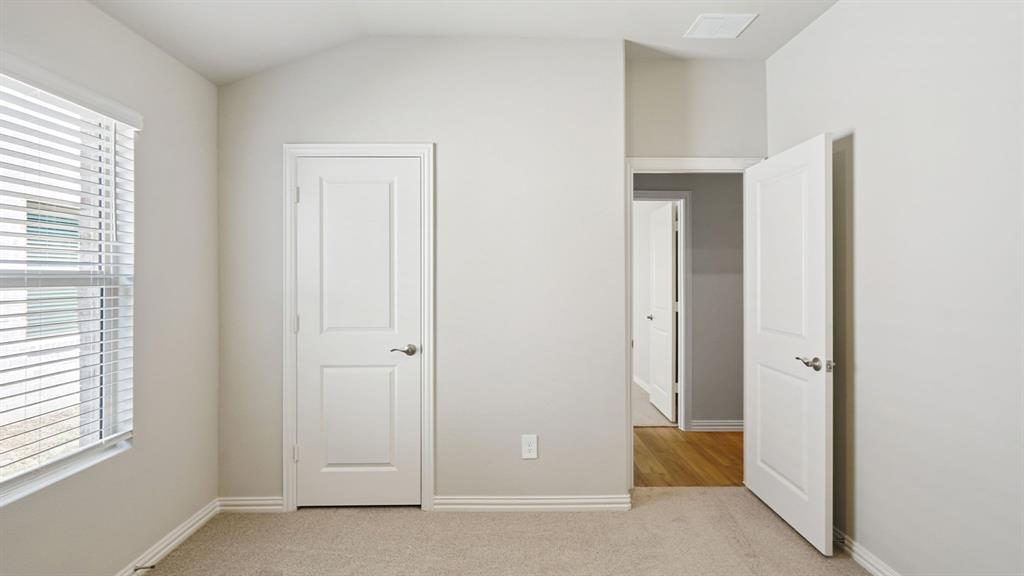 2218 Rannoch Street Sherman, TX 75092 - Photo 17 of 28 an empty room with windows and closet