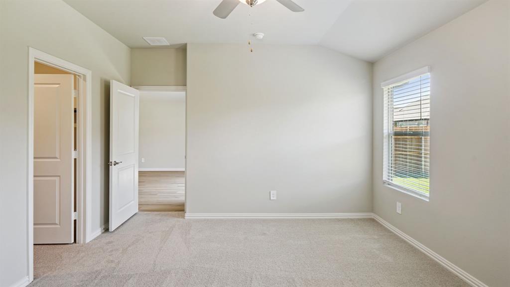 2218 Rannoch Street Sherman, TX 75092 - Photo 23 of 28 an empty room with windows and closet