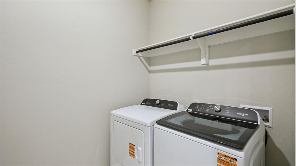 2218 Rannoch Street Sherman, TX 75092 - Photo 25 of 28 a utility room with dryer and washer