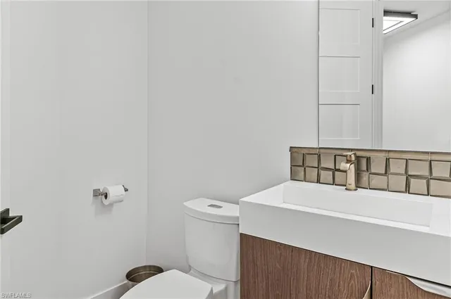 a bathroom with a sink and toilet