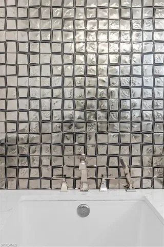 a bathroom with a sink and a shower curtain