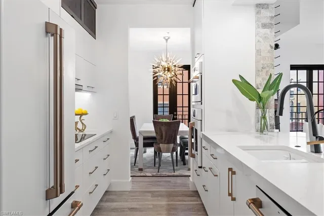 a dining room with furniture and wooden floor