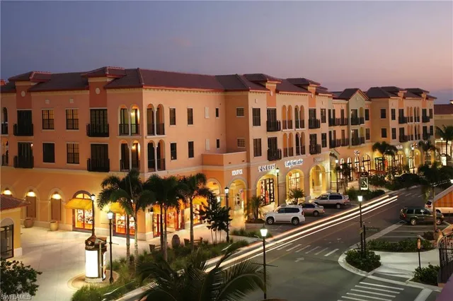 a front view of a building with parking spaces