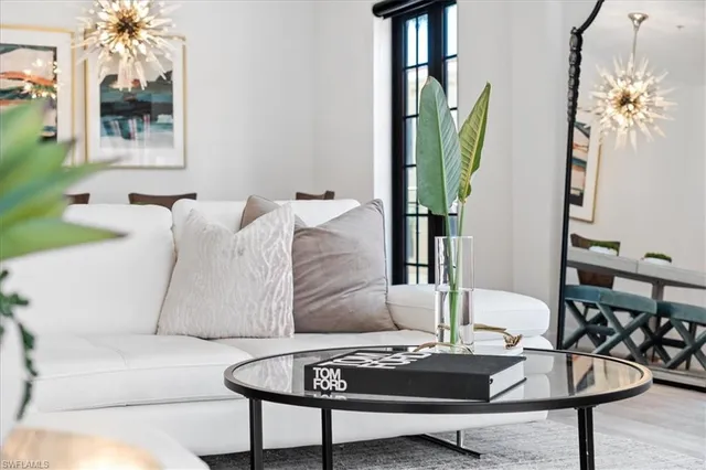 a living room with furniture and a table