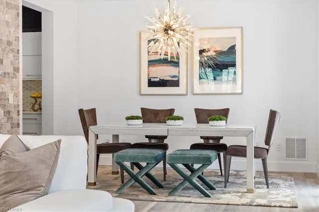 a dining room with furniture and window