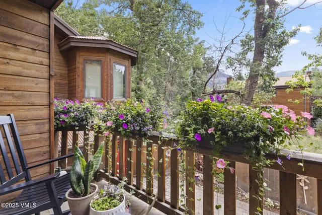 a bedroom with a large bed and a large window