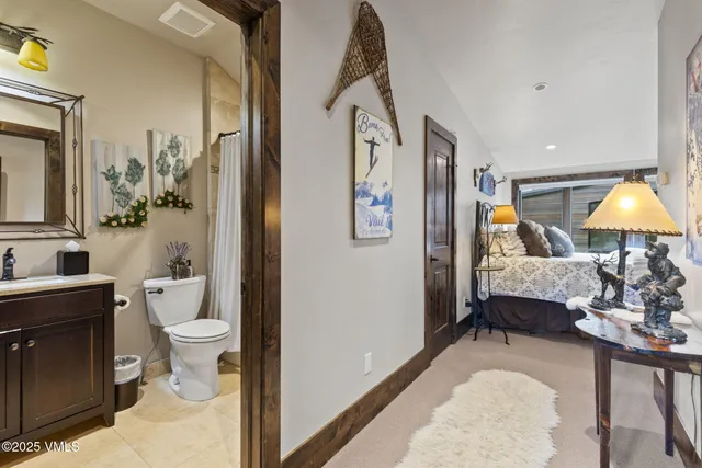 a bedroom with a large bed and a large window