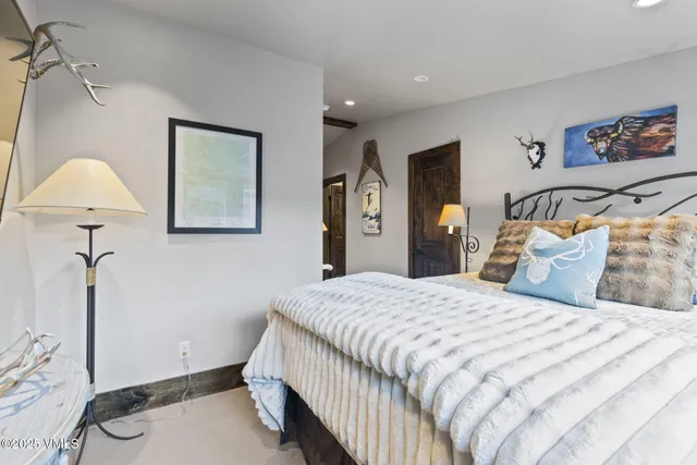 a front view of a house with yard and trees