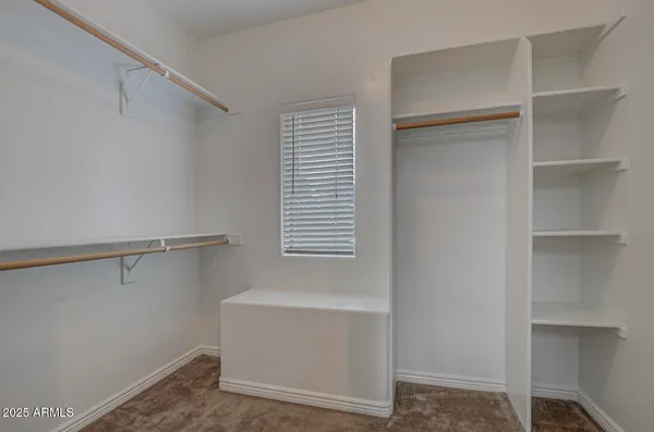 a couple of blue chairs sitting in front of a door