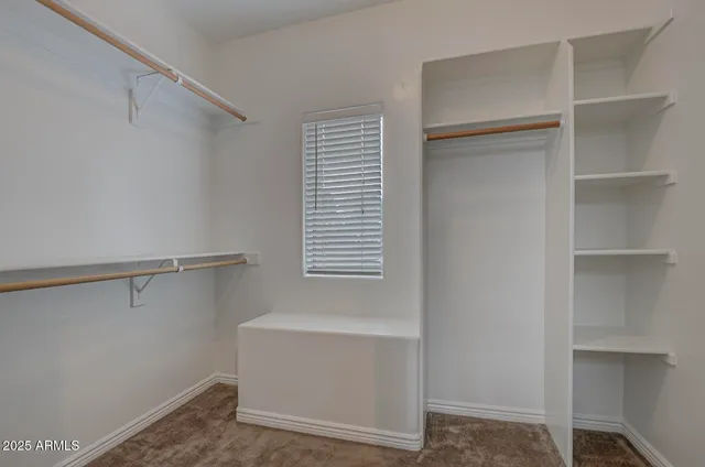 a couple of blue chairs sitting in front of a door