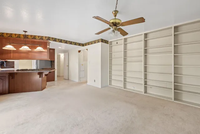 a view of a room with cabinet and mirrors