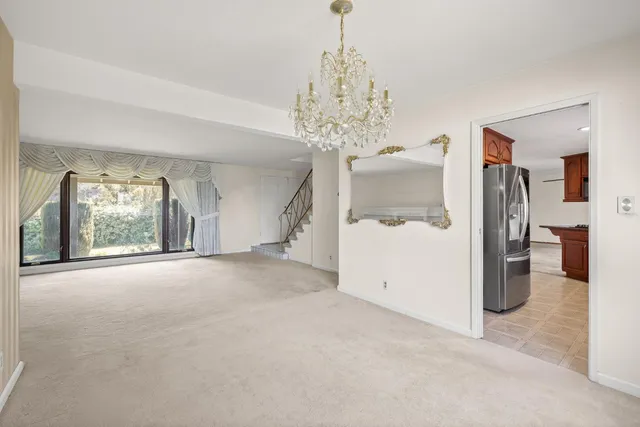 a view of a chandelier and a chandelier in a room