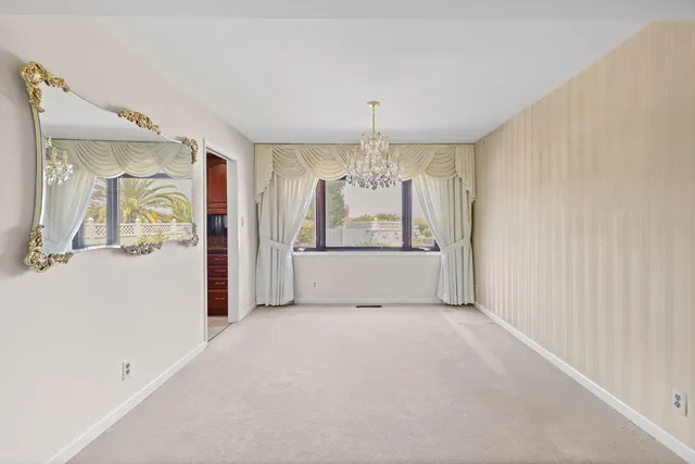 a view of a kitchen with refrigerator and cabinet