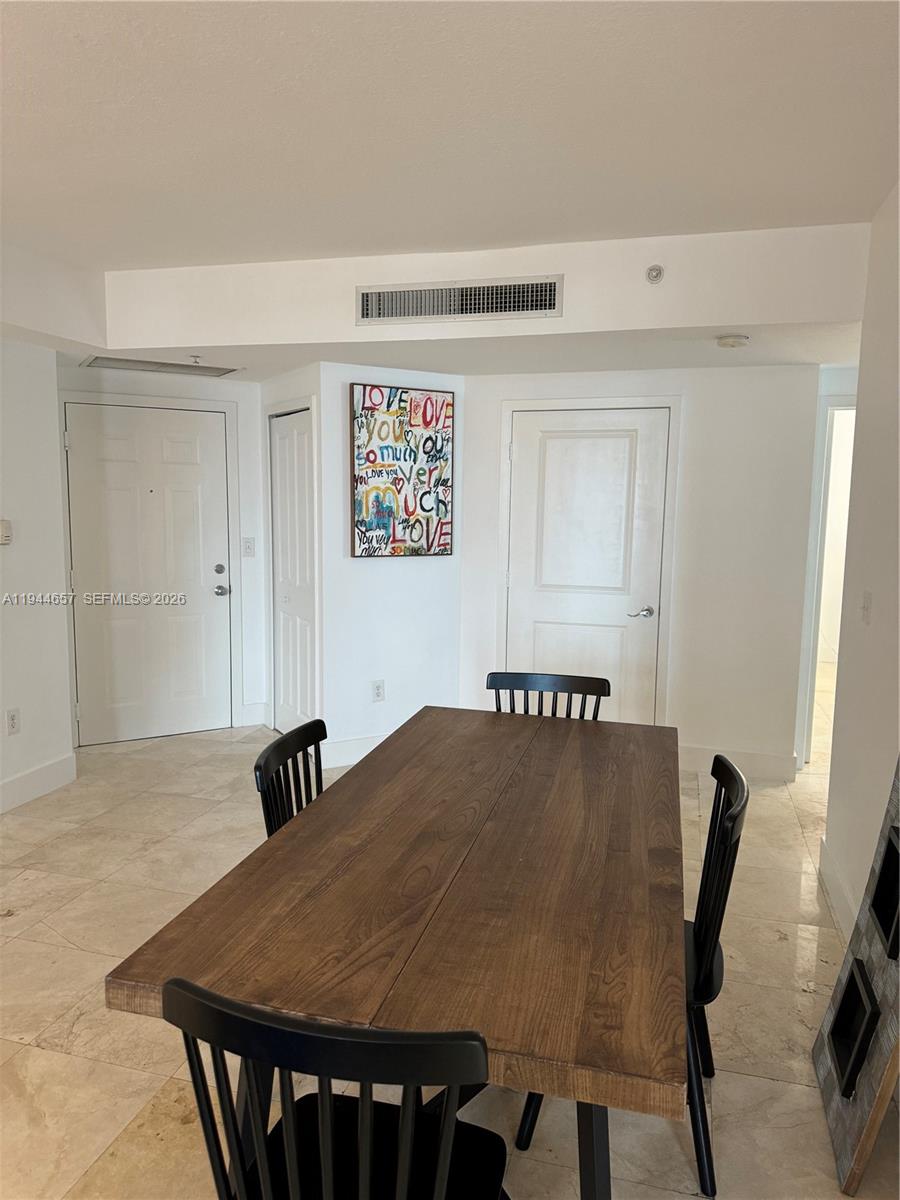 170 Southeast 14th Street, Unit 2405 Miami, FL 33131 - Photo 12 of 25 a view of a dining room with furniture
