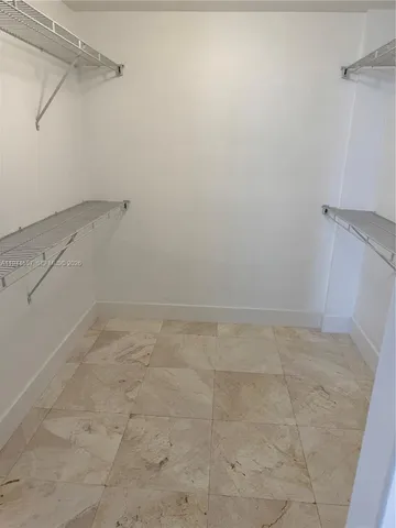 a view of a room with racks on the wall