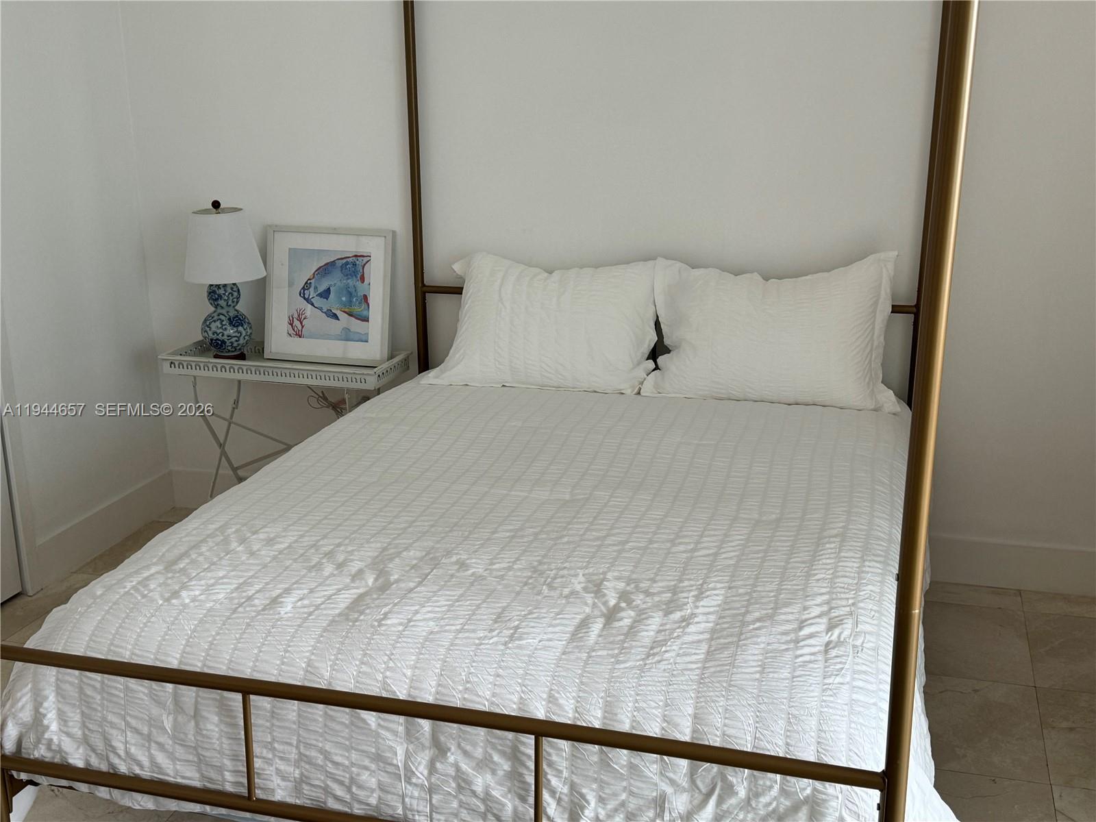 170 Southeast 14th Street, Unit 2405 Miami, FL 33131 - Photo 5 of 25 a bedroom with a bed and wooden floor