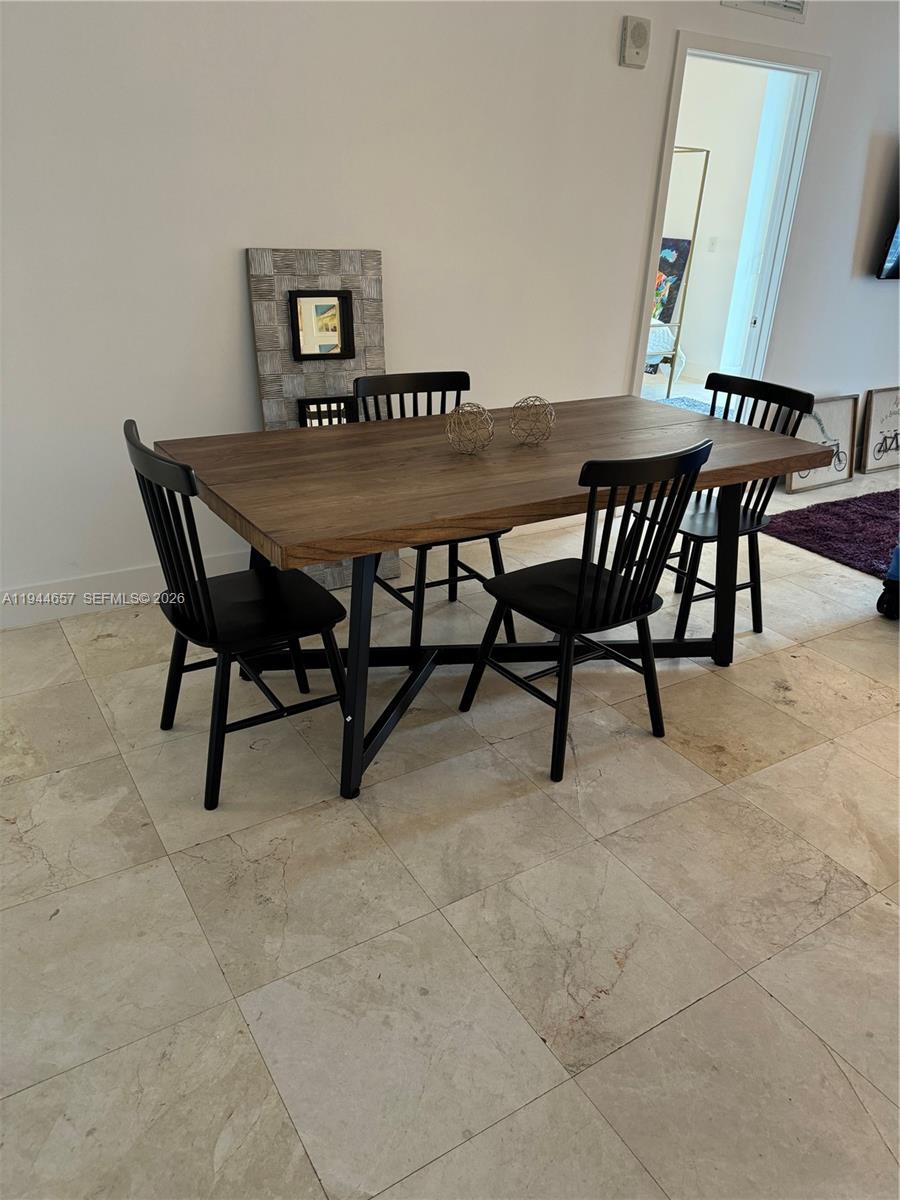 170 Southeast 14th Street, Unit 2405 Miami, FL 33131 - Photo 6 of 25 a view of a dining room with furniture