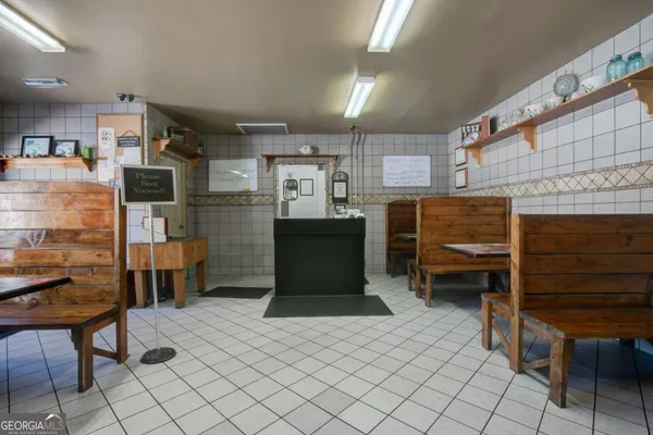 a kitchen with a refrigerator and a table