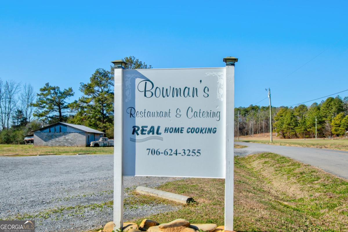 868 County Line Road Resaca, GA 30735 - Photo 2 of 44 a sign on the side of the road