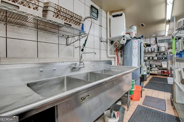 a bedroom with a bed and cabinets