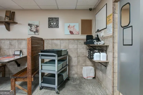 a stove top oven sitting inside of a kitchen
