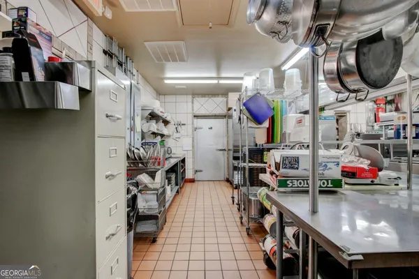 a kitchen with lots of counter top space and cabinets