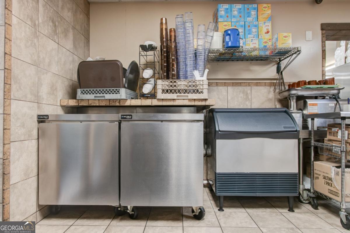 868 County Line Road Resaca, GA 30735 - Photo 32 of 44 a view of storage and utility room with washer and dryer