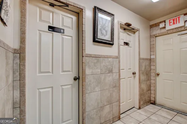 a bathroom with a toilet sink and shower