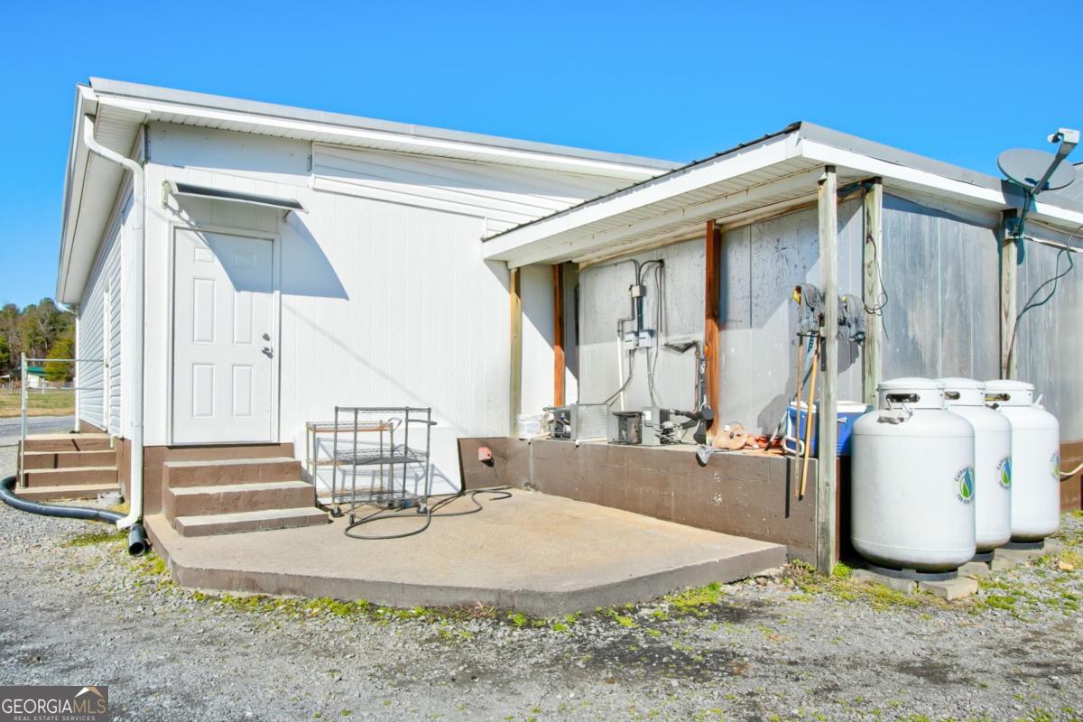 868 County Line Road Resaca, GA 30735 - Photo 37 of 44 a view of a house with outdoor kitchen