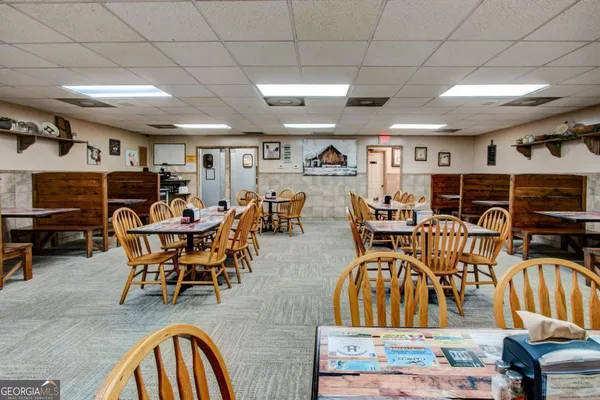a view of a dining room with furniture