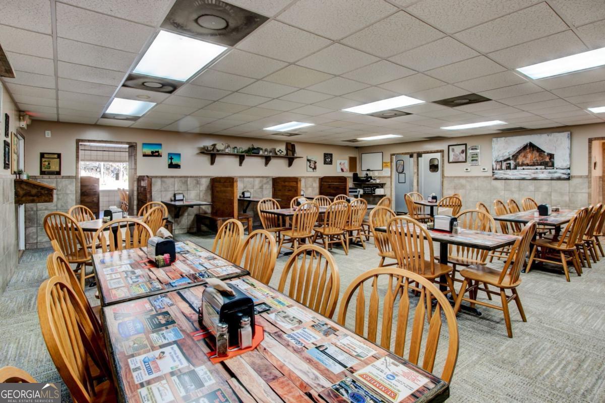 868 County Line Road Resaca, GA 30735 - Photo 9 of 44 a very nice looking living room with furniture and kitchen view