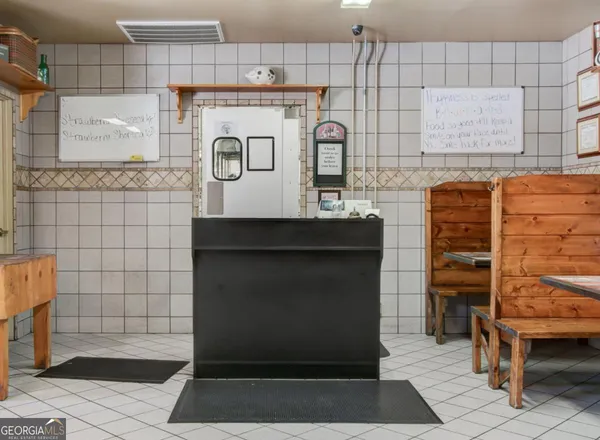 a kitchen with stainless steel appliances kitchen island granite countertop a refrigerator and a stove