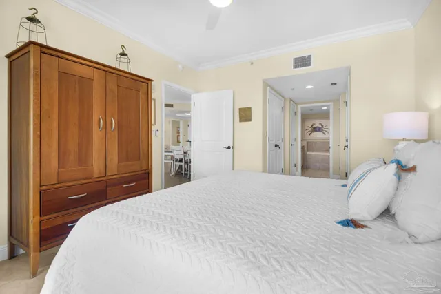 a bedroom with a bed and a dresser