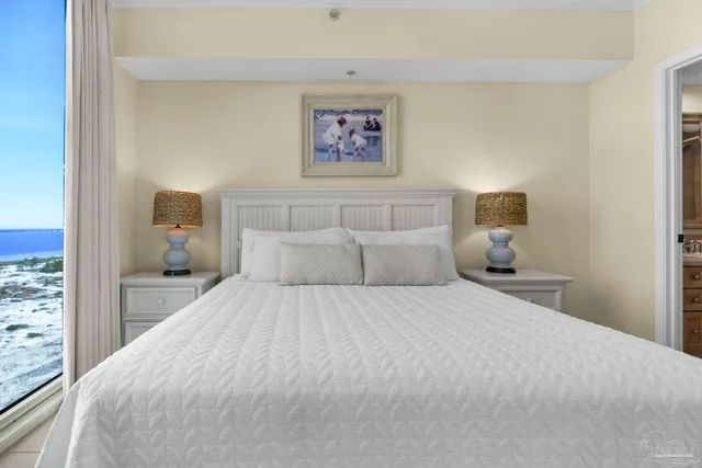 a bedroom with a bed and night stand