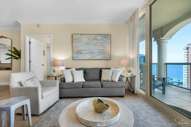 a living room with furniture and a large window