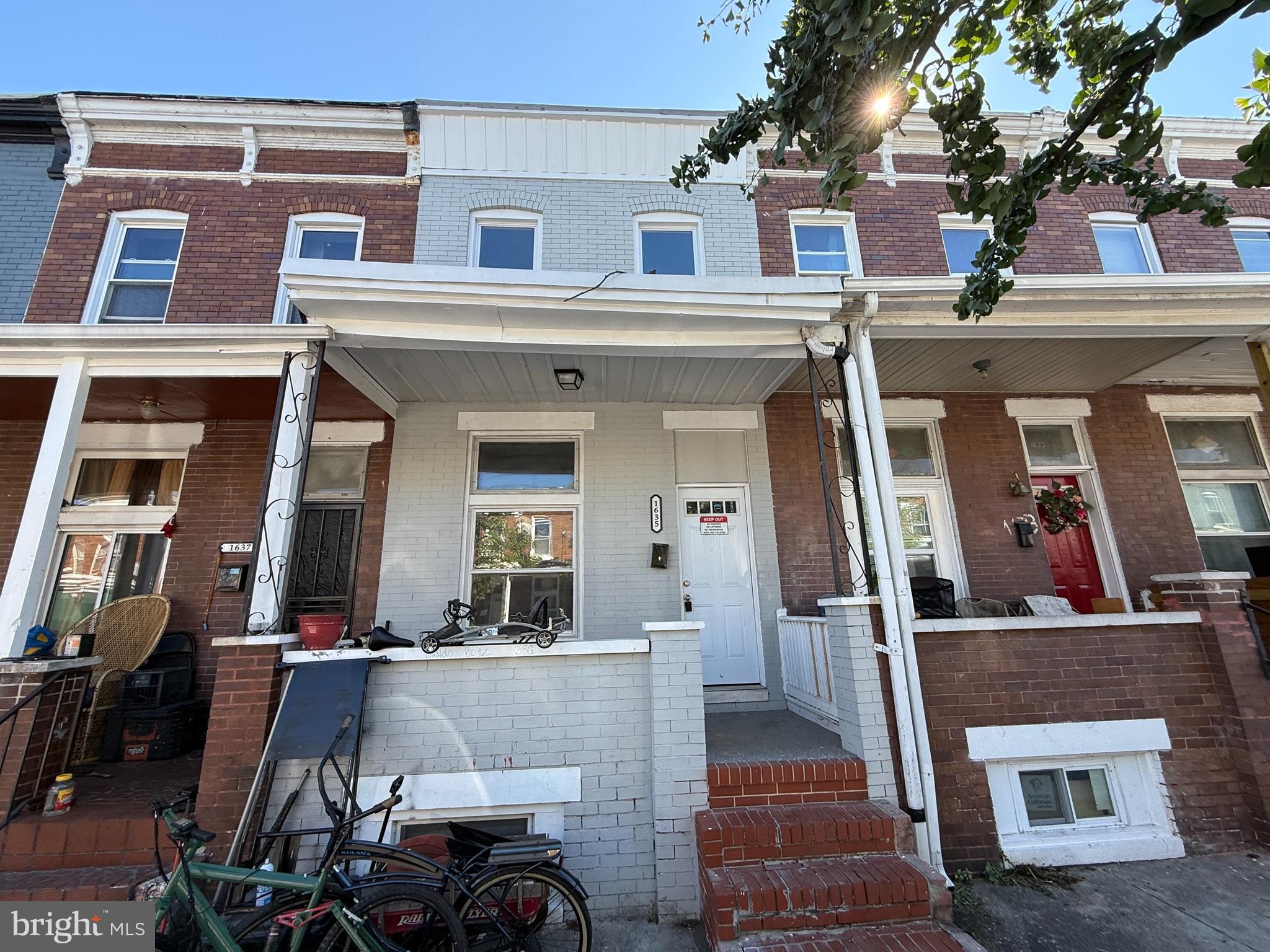 a front view of a building with many windows